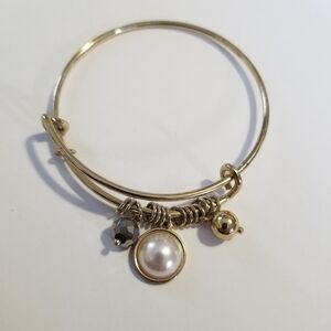 gold tone expandable bangle bracelet with faux pearl